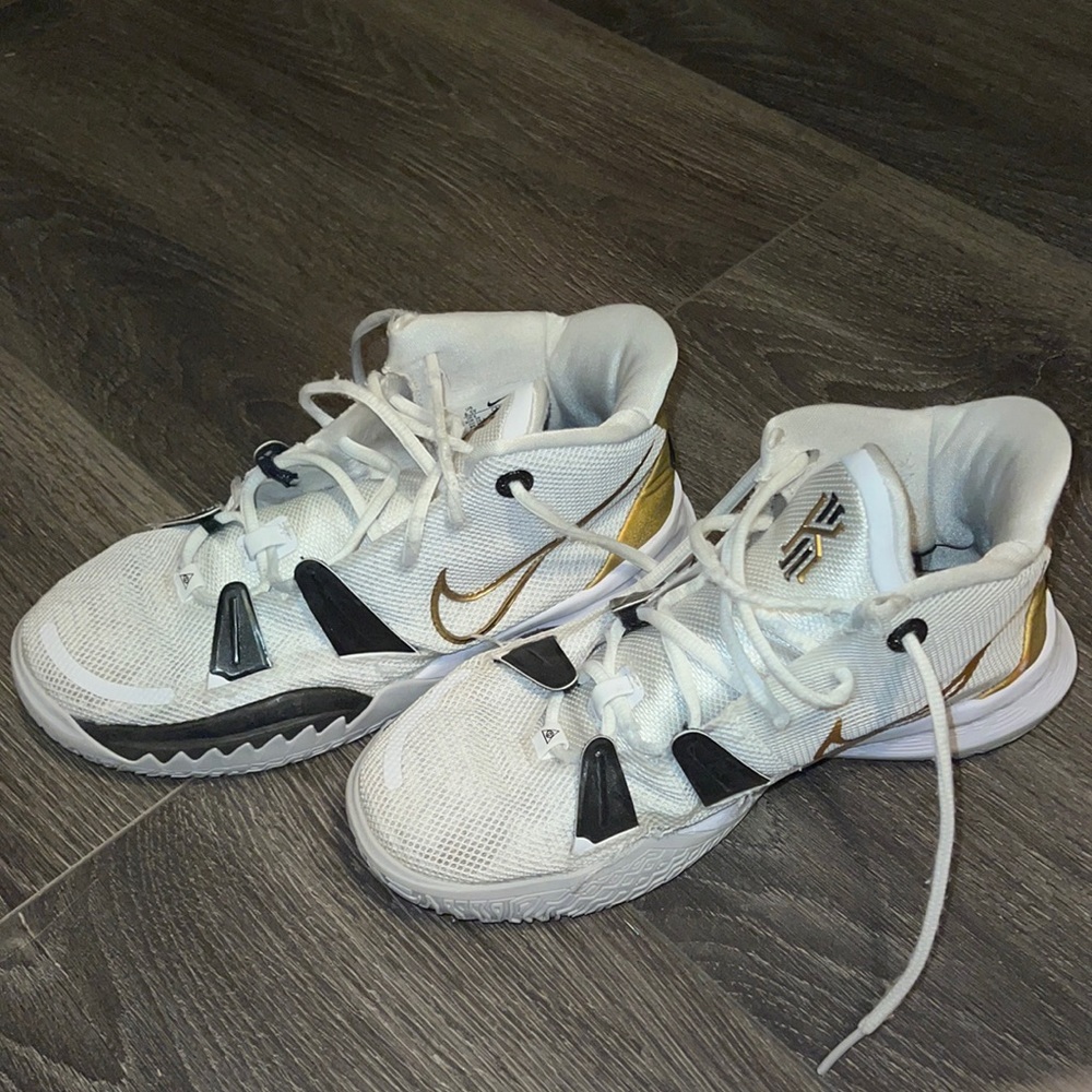 Black white and gold basketball shoes